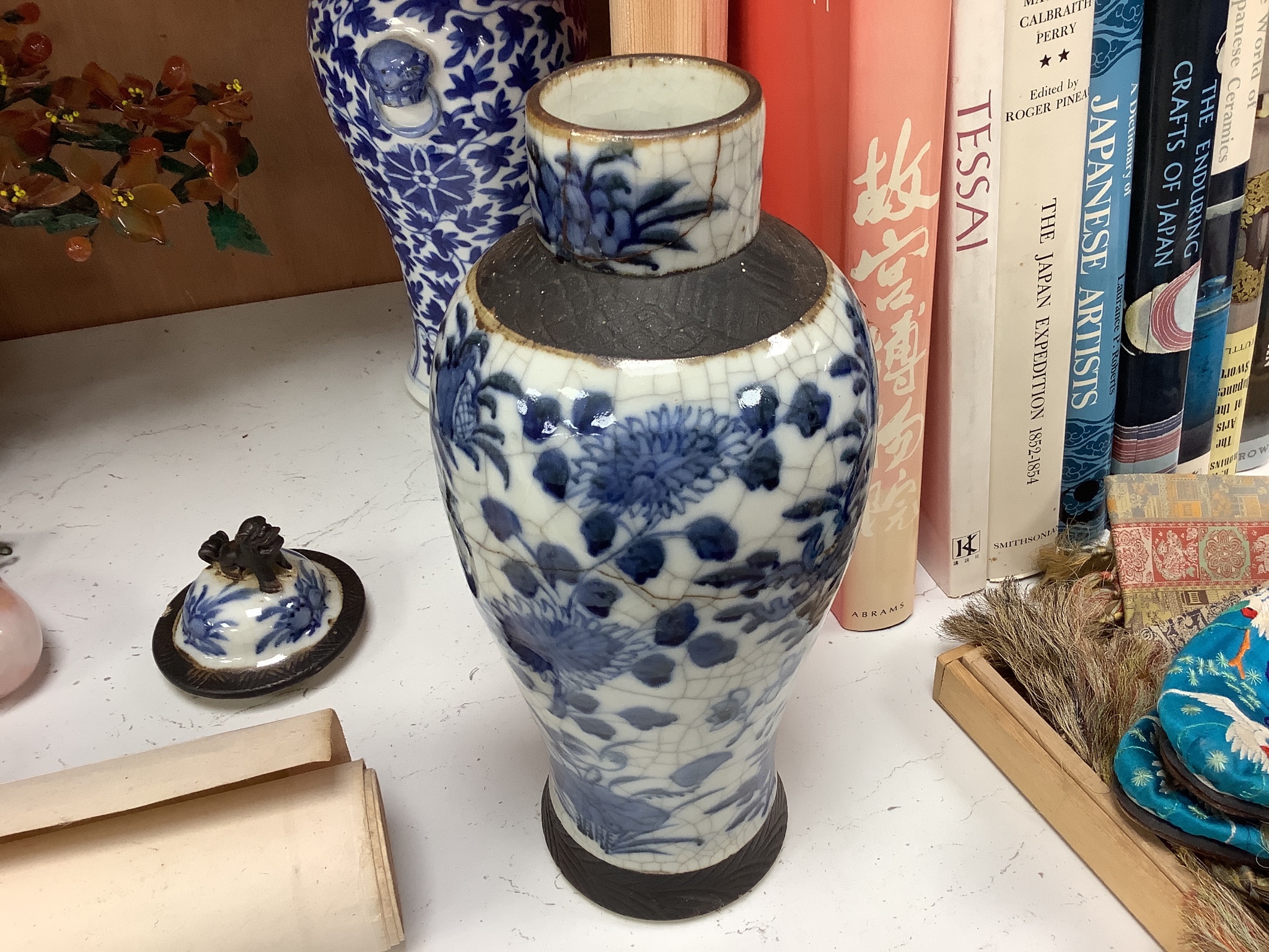 A 19th century Chinese blue and white vase, a similar crackle glaze vase and a powder blue jar, mounted as a lamp, tallest 32cm